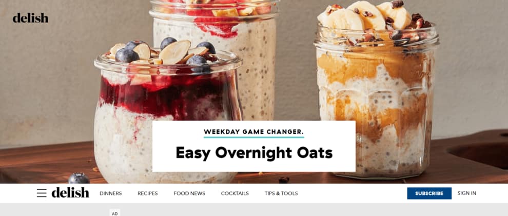 Delish homepage hero section with "Easy Overnight Oats" image and headline.
