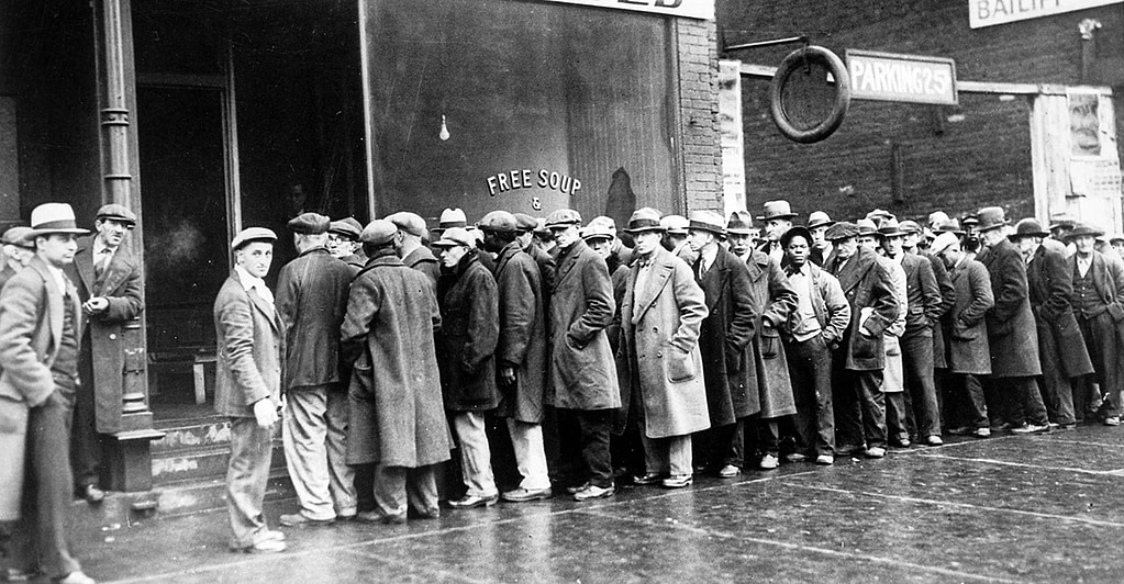 Unemployed men queued outside a depression soup kitchen in Chicago