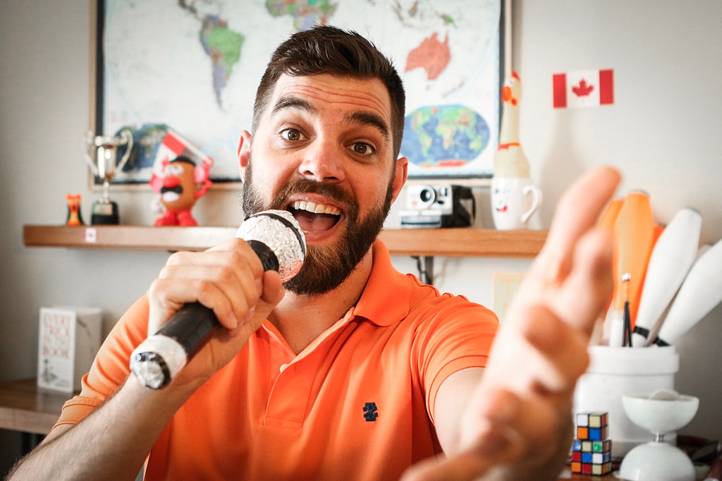 Teacher Michael with a microphone prop
