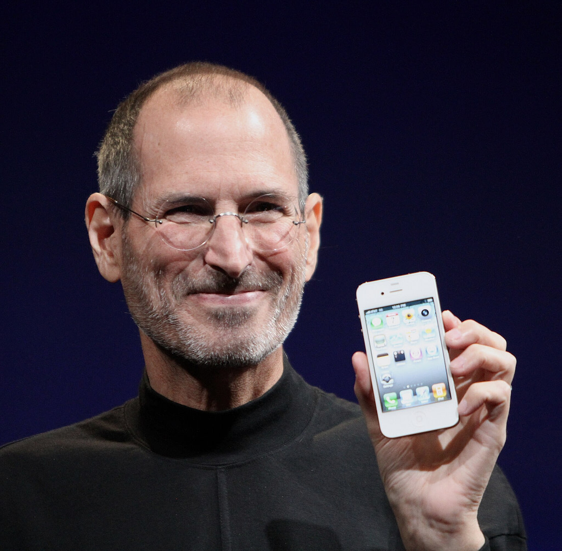 Steve Jobs showcasing iPhone