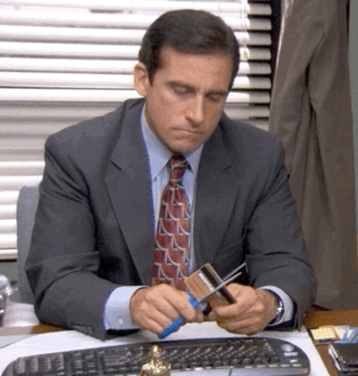 Michael Scott cutting up a credit card