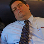 Man sleeping in train seat