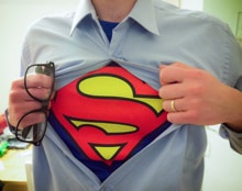 Office worker opens shirt to reveal Superman logo